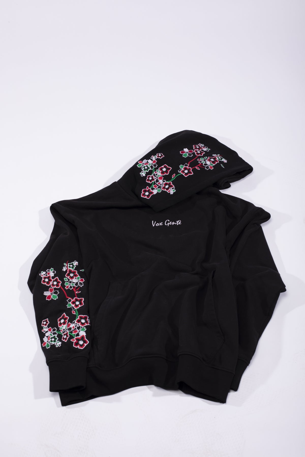 Farasha Hoodie: black hoodie with an embroidered butterfly in Lebanese colours and cascading Palestinian poppies (view 3)